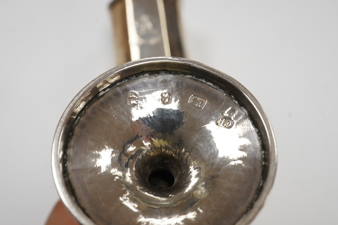 A George III provincial silver egg shaped pedestal pepperette, by Christian Ker Reid, Newcastle, circa, 1810, height 89mm, together with a pair of late Victorian octagonal pepperettes.